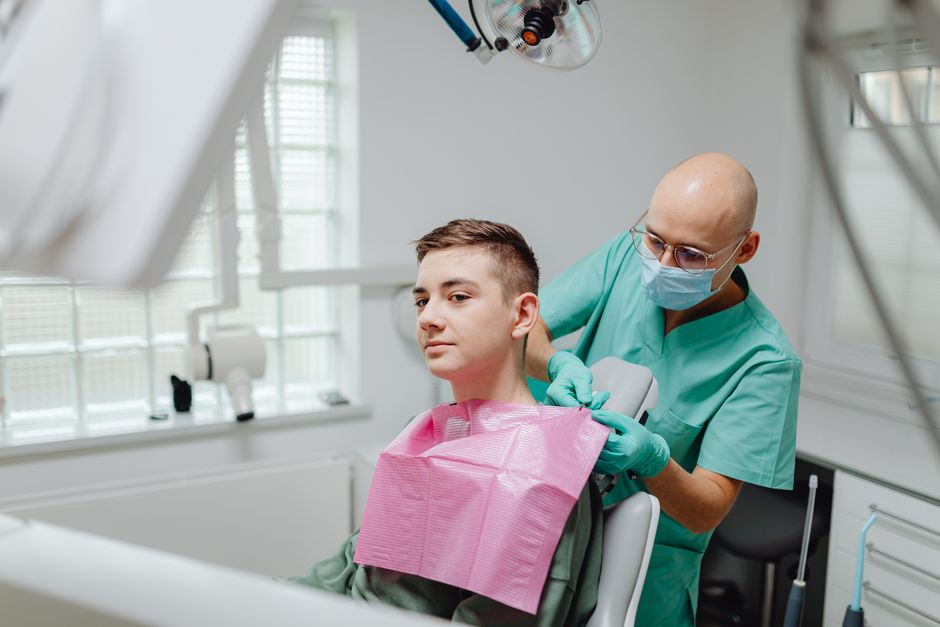 Dentist treating a calm, comfortable patient